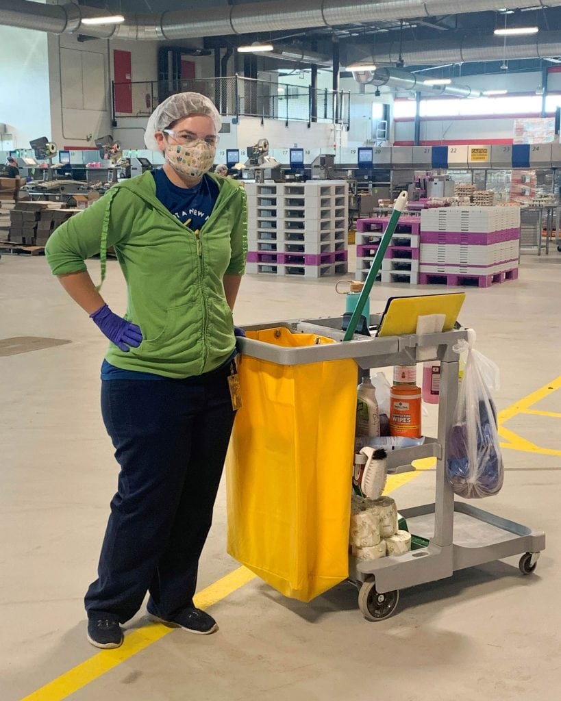 Portrait of Lendsi Armstrong with her cleaning gear at Vital Farms Egg Central Station